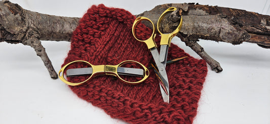 faltbare Schere goldfarbend